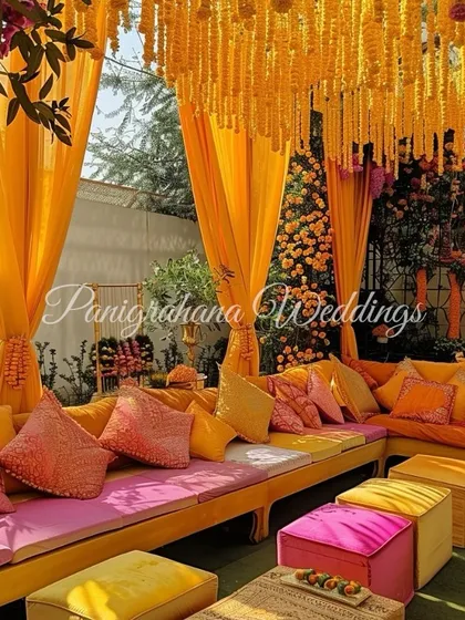Another view of the cozy Mehendi lounge, with a canopy of marigolds creating a warm and festive atmosphere.