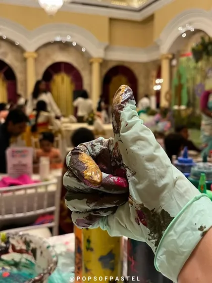 A thumbs-up for a successful art party. Even our gloves get colorful. We can bring the entire art station experience, complete with all supplies, to luxury hotels and other venues for a truly special celebration.