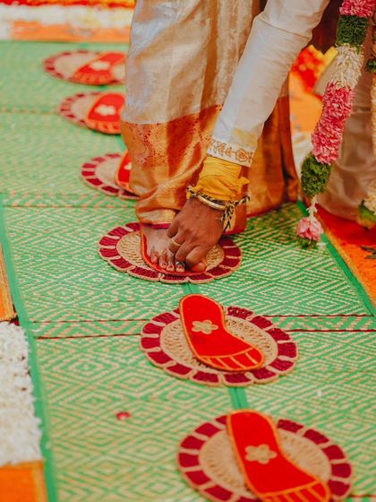 Capturing the details of the Saptapadi, or seven steps, a ritual symbolizing the seven vows of marriage. This shot focuses on the tradition itself.
