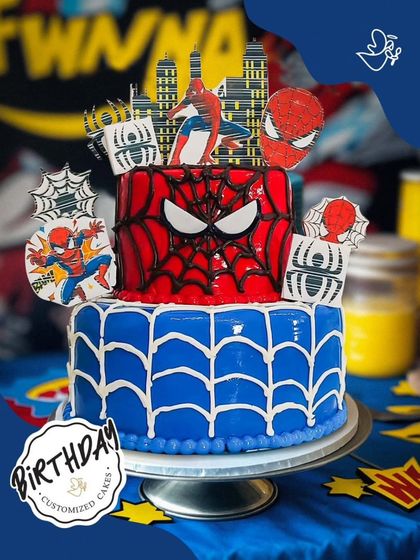 A two-tier Spider-Man cake that's double the fun. The top tier features his iconic red web design, while the bottom tier has a cool blue web pattern, perfect for a big celebration.