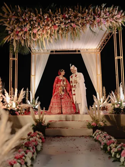 We love a grand celebration, and this sunset wedding in Goa was a dream. This shot of the mandap shows the scale and beauty we can capture, ensuring that every element of your destination wedding, big or small, is remembered forever.
