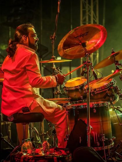 Our drummer in action, providing the powerful backbeat for our Sufi rock sound at a club event.