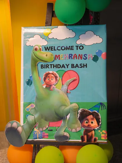 A personalized welcome sign for the birthday bash. This "The Good Dinosaur" themed easel greets guests at the entrance, making the birthday child feel extra special from the moment they arrive.