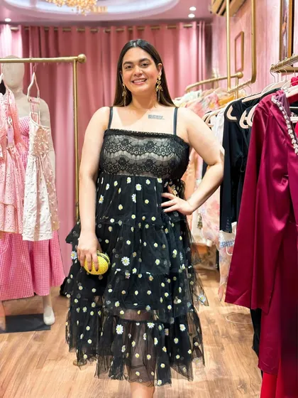 I'm fully embracing my girly side in my 30s. I re-wore this beautiful tiered dress from Lea Clothing for their store launch, styling it with whimsical dragonfly earrings to show its versatility.