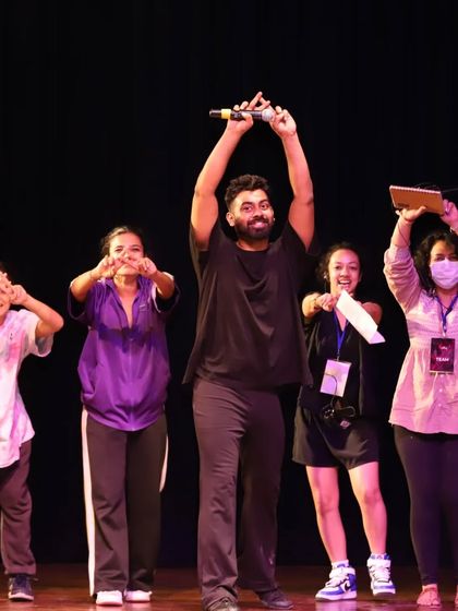 That feeling after nailing the final performance. Our founder, Manas, celebrating on stage with the crew after a successful show.