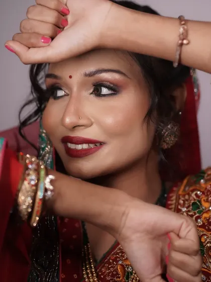 A candid shot of the Bihari bride, her expressive eyes and radiant smile enhanced by the makeup.