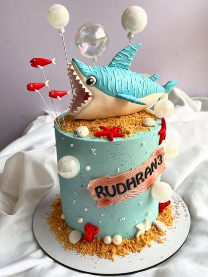 Celebrating four years of making cakes for a special client. This image shows the shark-themed cake from his most recent birthday.