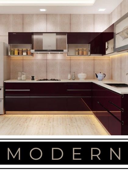 A bold, modern kitchen design featuring deep maroon high-gloss cabinets. The L-shaped layout is complemented by under-cabinet and kick-plate lighting, creating a dramatic and sophisticated atmosphere.