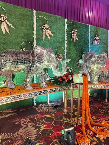 A pair of our signature mirrored elephant props, creating a symmetrical and regal welcome for guests.