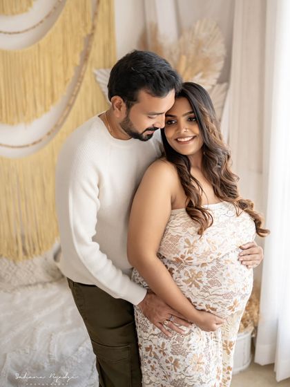 The way he looks at her is so full of love. This candid moment captures the deep admiration and connection between the couple during their maternity session.