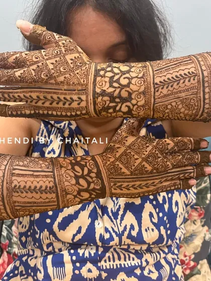Another view of the semi-bridal mehendi, showing how the design looks from a different angle. The patterns include florals, checks, and traditional motifs.