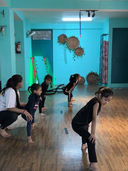 Guiding the class through posture exercises. A strong, aligned posture is the starting point for every dance move we teach.