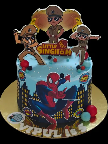 Another version of the Spider-Man and Little Singham cake, this design is perfect for a 5th birthday celebration, featuring action-packed poses and city skyline details.