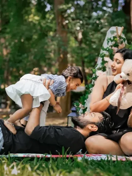 An outdoor family session in one of Bangalore's lovely parks. We use natural light to create vibrant, candid portraits that feel spontaneous and joyful, just like this moment of a father playing with his child.