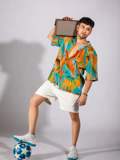 This look is all about summer vibes. I styled this vibrant, tropical-print shirt with crisp white shorts for a fresh and fun vacation or weekend outfit.