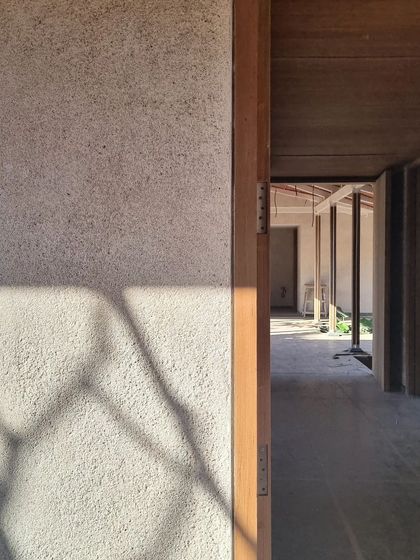 A beautiful and simple wall finish we developed for our Alibaug house collaboration. The plaster is a mix of white cement, lime, and river sand, creating a soft, textured surface that catches the light.