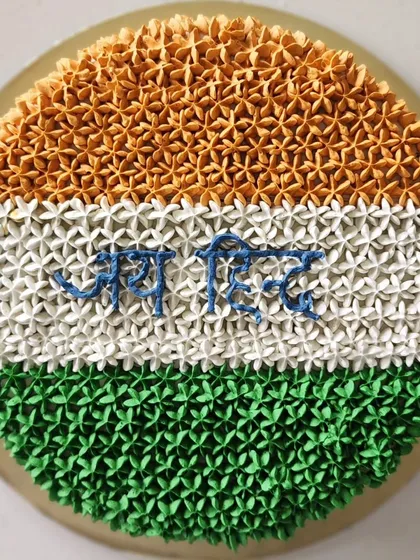 I was so proud to bake this cake for Independence Day. It's a chocolate hazelnut cake decorated with Swiss buttercream in the colours of our flag, with "Jai Hind" piped in the center.