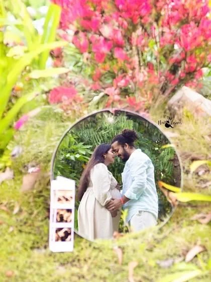 We love finding creative ways to tell your story. This artistic reflection shot, taken during an outdoor pregnancy photoshoot, frames the couple's love within the beauty of nature, with their sonogram pictures adding a personal touch.