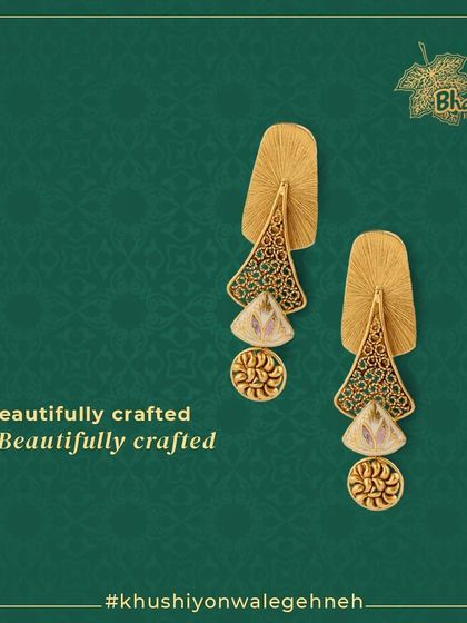 Beautifully crafted earrings featuring Kundan, Meenakari, pearls, and diamonds. The unique design combines traditional filigree work with modern shapes for a truly elegant statement.