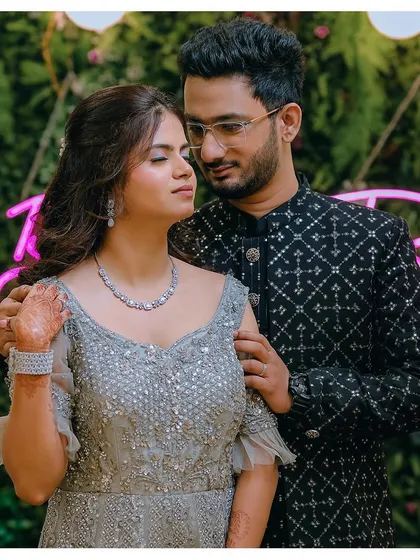Ashlesha's engagement look for her party. The duo-chrome eye makeup was designed to work with both her traditional pink saree and this modern grey gown.