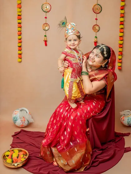 A beautiful moment between mother and son, recreating the bond of Yashoda and Krishna. I love including parents to add emotional depth to these traditional photoshoots.