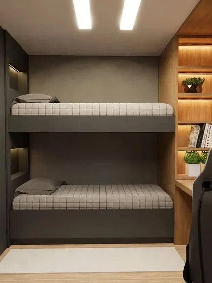 A space-saving solution for a shared kids' room, this custom-built bunk bed in a dark grey finish is both stylish and sturdy. Each bunk has its own niche with lighting.