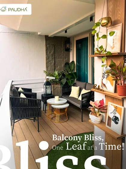 Balcony bliss is all about the details. For this space, we combined comfortable, modern outdoor furniture with a variety of plants and decor. The wooden flooring, floating shelves for displaying art, and a mix of planters create a stylish and functional retreat, proving you don't need a huge area to live beautifully.