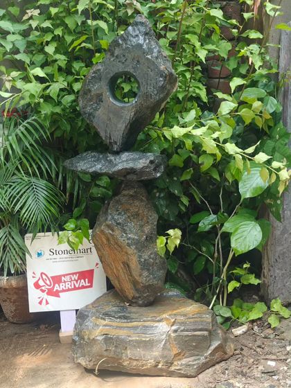 A detailed shot of the 'Balance of Life' sculpture, highlighting the textures and the central void that gives the piece its character. It is a modern garden accent that is sure to start conversations.