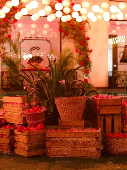We love adding charming, rustic details. This installation of wooden crates and woven baskets filled with fresh apples provided a warm, countryside feel that contrasted beautifully with the more glamorous elements of the set design.