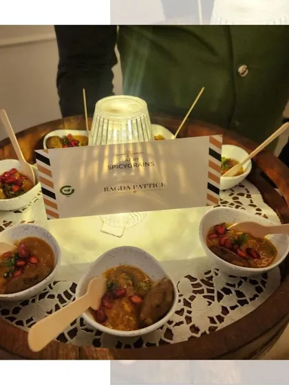 A tray of Ragda Pattice, another beloved Indian street food. We serve the potato patties topped with a savory pea curry in individual bowls for elegant, mess free enjoyment.