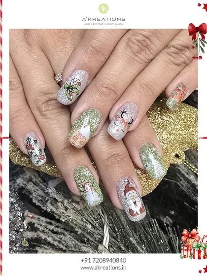 A playful and festive Christmas character set. Each nail features a different hand-painted icon like Santa, a snowman, and a reindeer over a sparkling glitter base.