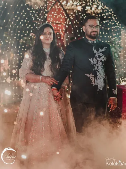 Another shot of the couple's magical entrance, with the soft smoke and warm lights creating an ethereal glow around them.