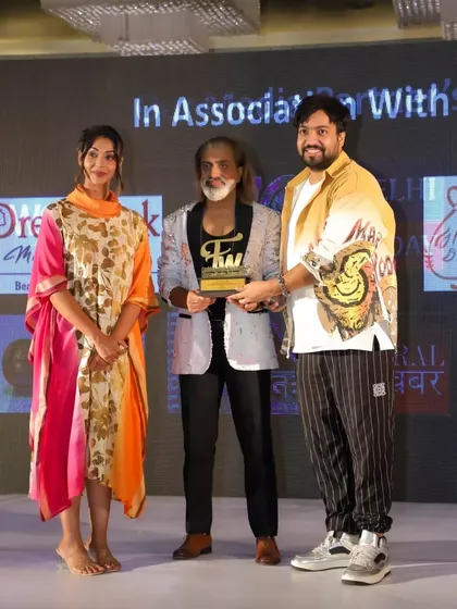 A proud moment receiving the award for Best Bridal Wear Designer from Bollywood actress Anupriya Goenka.