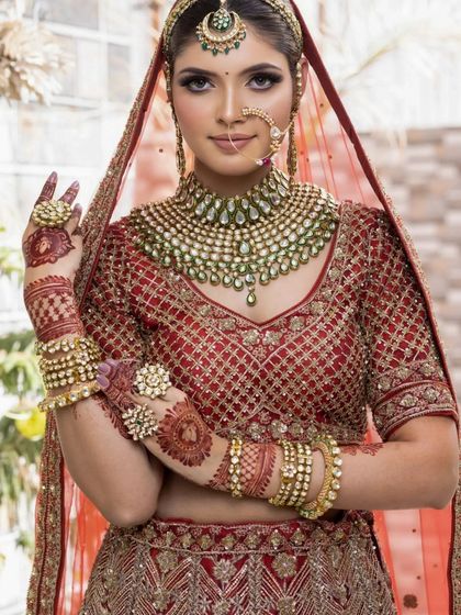 This bride is showing off her intricate henna. The makeup is kept classic and elegant to let all the details shine.