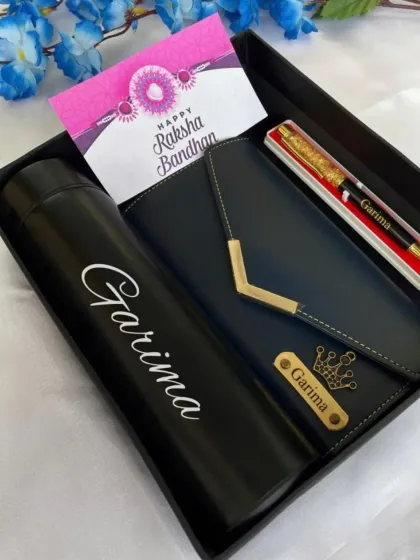 Surprise your sister this Rakshabandhan with a personalized hamper. This set includes a custom name bottle, a stylish clutch, a personalized wallet, and a beautiful pen.