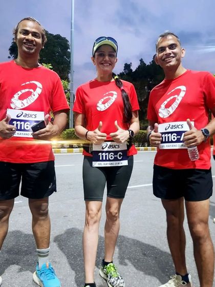Three runners from our club posing together. We foster an environment where members motivate and support each other.