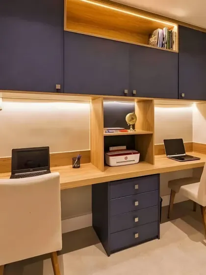 A practical and sleek dual-workstation we designed. The navy blue cabinets offer plenty of storage, while the shared wooden countertop provides a generous and collaborative workspace.