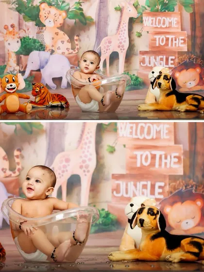 Welcome to the jungle. This adorable baby is having a splash in a tub-time setup, surrounded by friendly jungle animals for a fun and playful themed shoot.