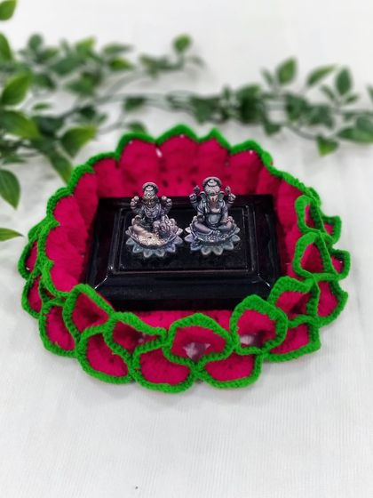 This pink and green lotus aasan provides a beautiful and sacred space for small Lakshmi and Ganesh idols, making your pooja setup even more special.