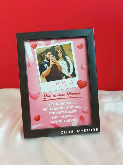 A mini frame for an anniversary, featuring a polaroid-style photo and a sweet, personal message.