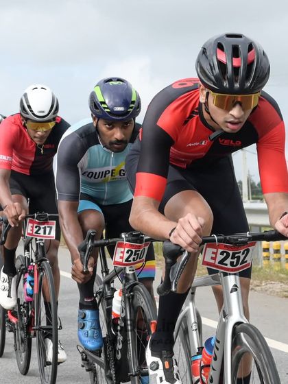 Elite riders at the front of the pack, battling for position and control of the race.