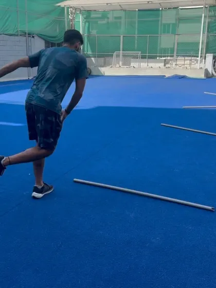 An athlete works on single-leg lateral bounds. This drill is excellent for developing power and stability in the frontal plane, essential for cutting and agility.