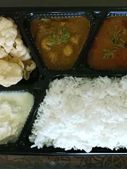 This is what my typical homemade veg meal box looks like. Here I have my Gongura meal maker curry, Pappucharu (a tangy lentil soup), homemade papads for crunch, fluffy white rice, and fresh curd.