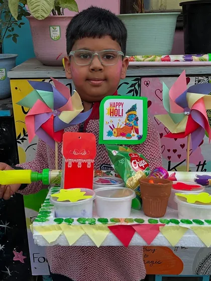 This student's Holi tray is packed with everything needed for the festival, including snacks!