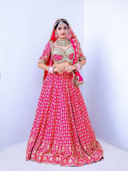 Another full-length view, this time with the bride looking directly at the camera. This classic bridal pose is perfect for showcasing the entire outfit.