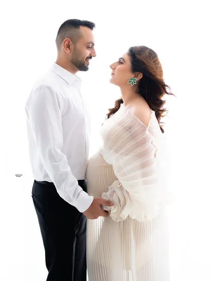 A classic pose, holding hands and looking at each other. You can feel the deep connection and love between them.