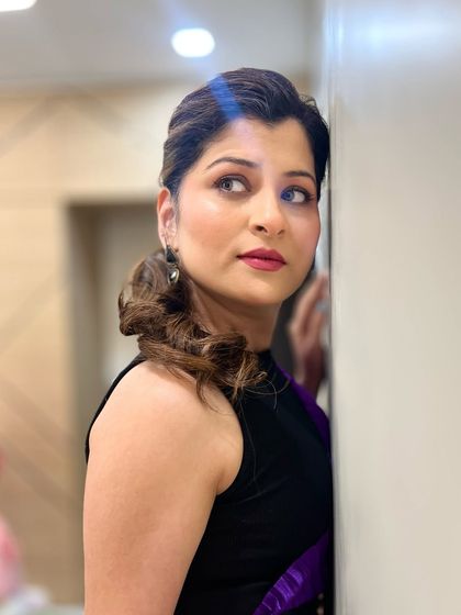 A beautiful profile shot of Savaniee. Her makeup looks flawless from every angle, highlighting her best features.