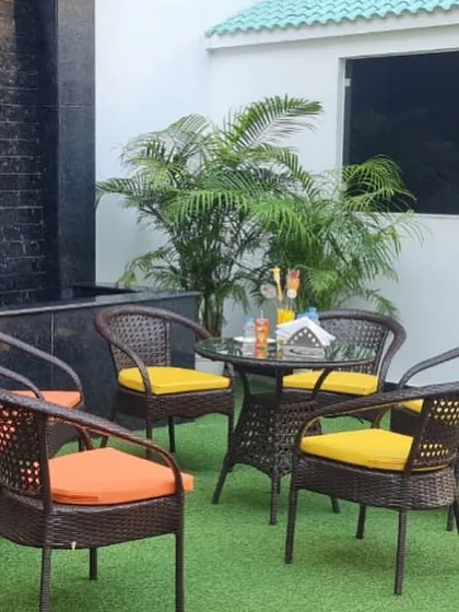 An outdoor seating arrangement for parents to relax and socialize during a party on our green turf.