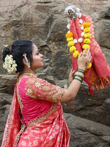 A closer look at the Gudi and the festive attire, highlighting the intricate embroidery on the blouse and the traditional jewellery.
