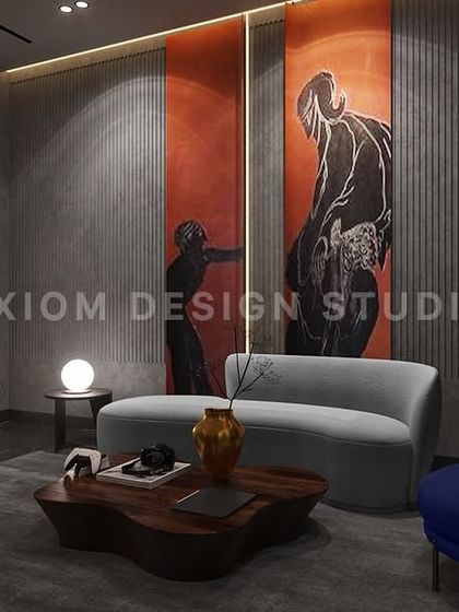 A comfortable seating area is carved out in the corner of this dark-themed bedroom, complete with a modern fireplace. It’s a perfect spot for quiet reflection.